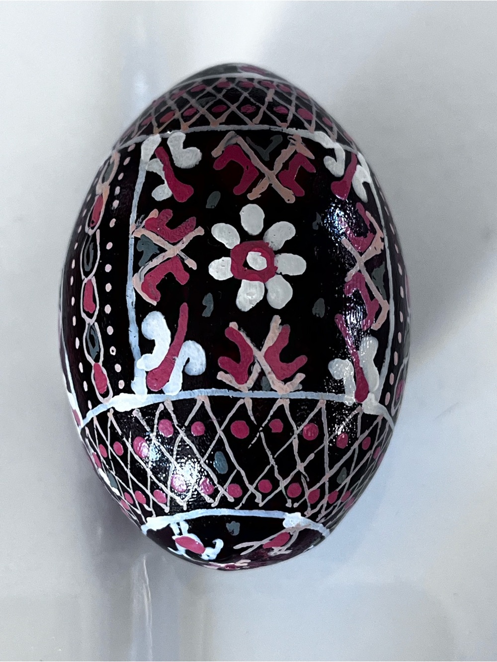 Handcrafted Black Floral Decorative Egg with Pink Accents Made of Wood